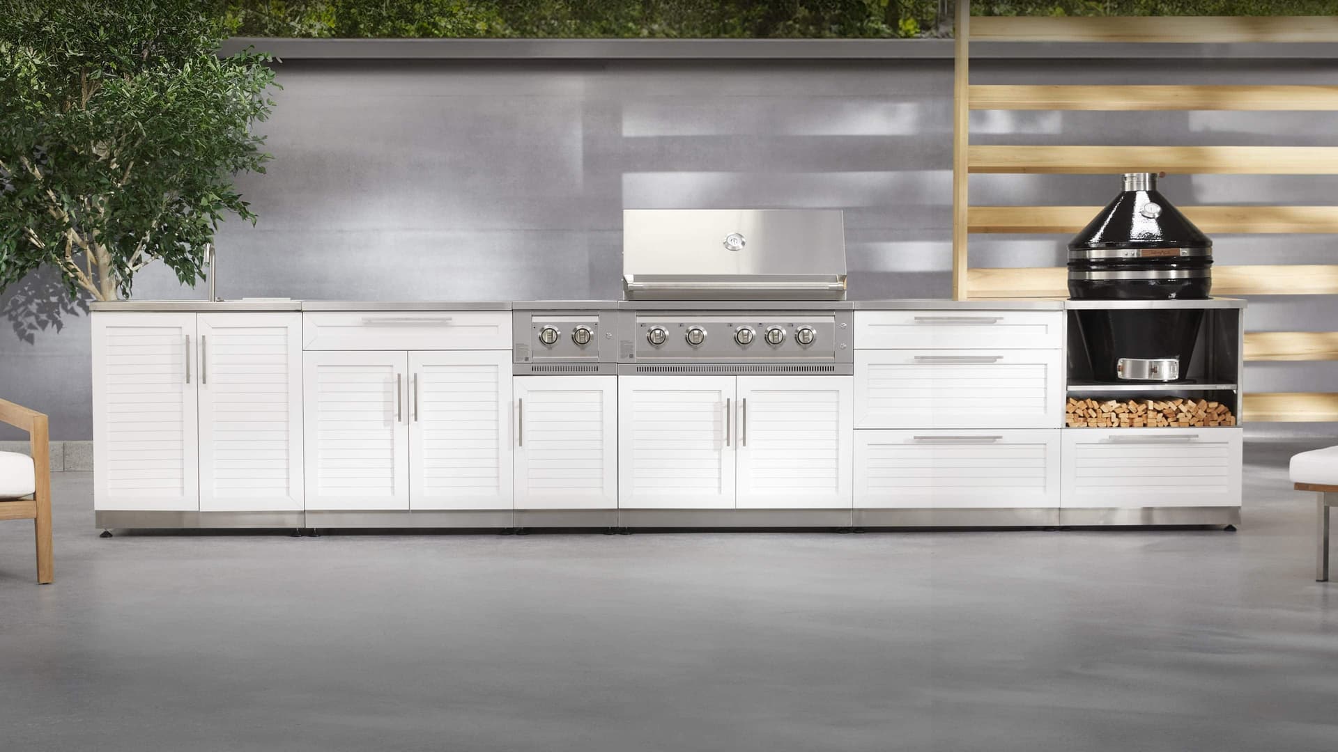 Stainless steel NewAge outdoor kitchen cabinets with a countertop bar and stools