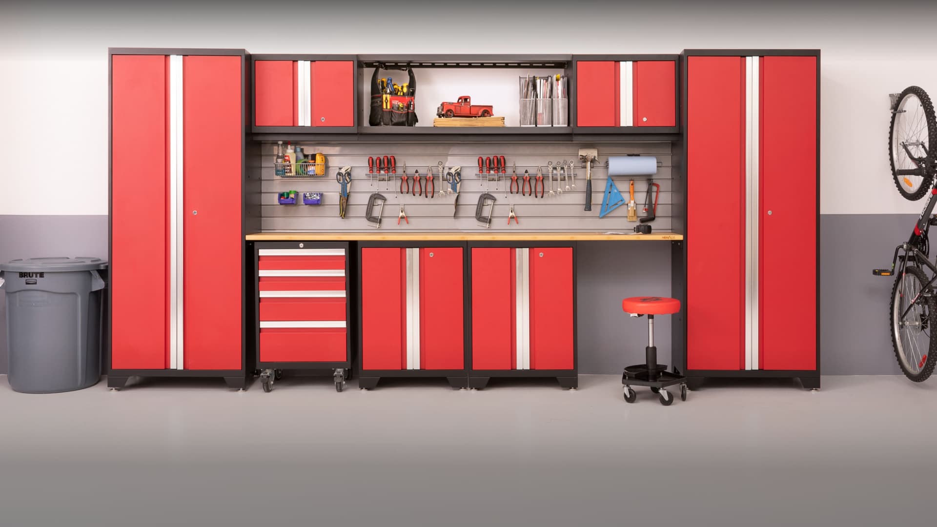 NewAge garage workbench and tall storage cabinets alongside a parked car