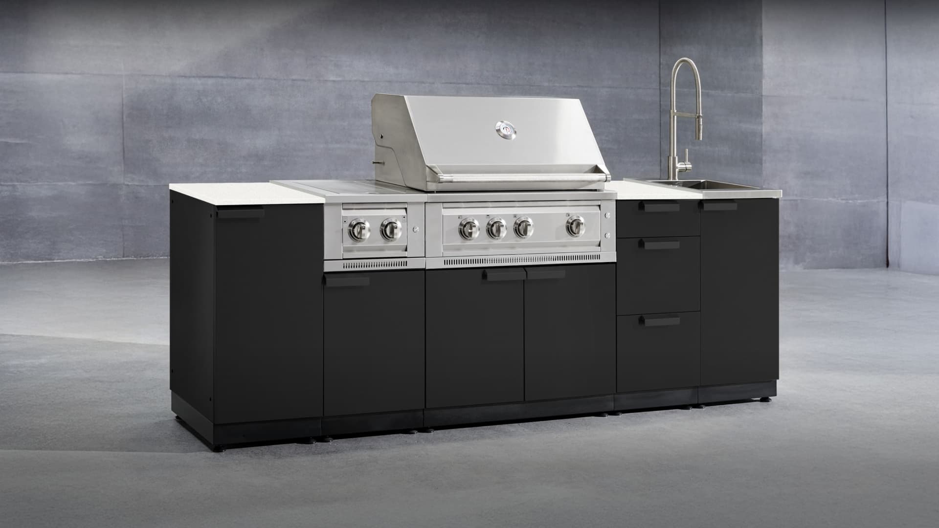 NewAge modular grill island with a built-in gas grill and stone-look countertop