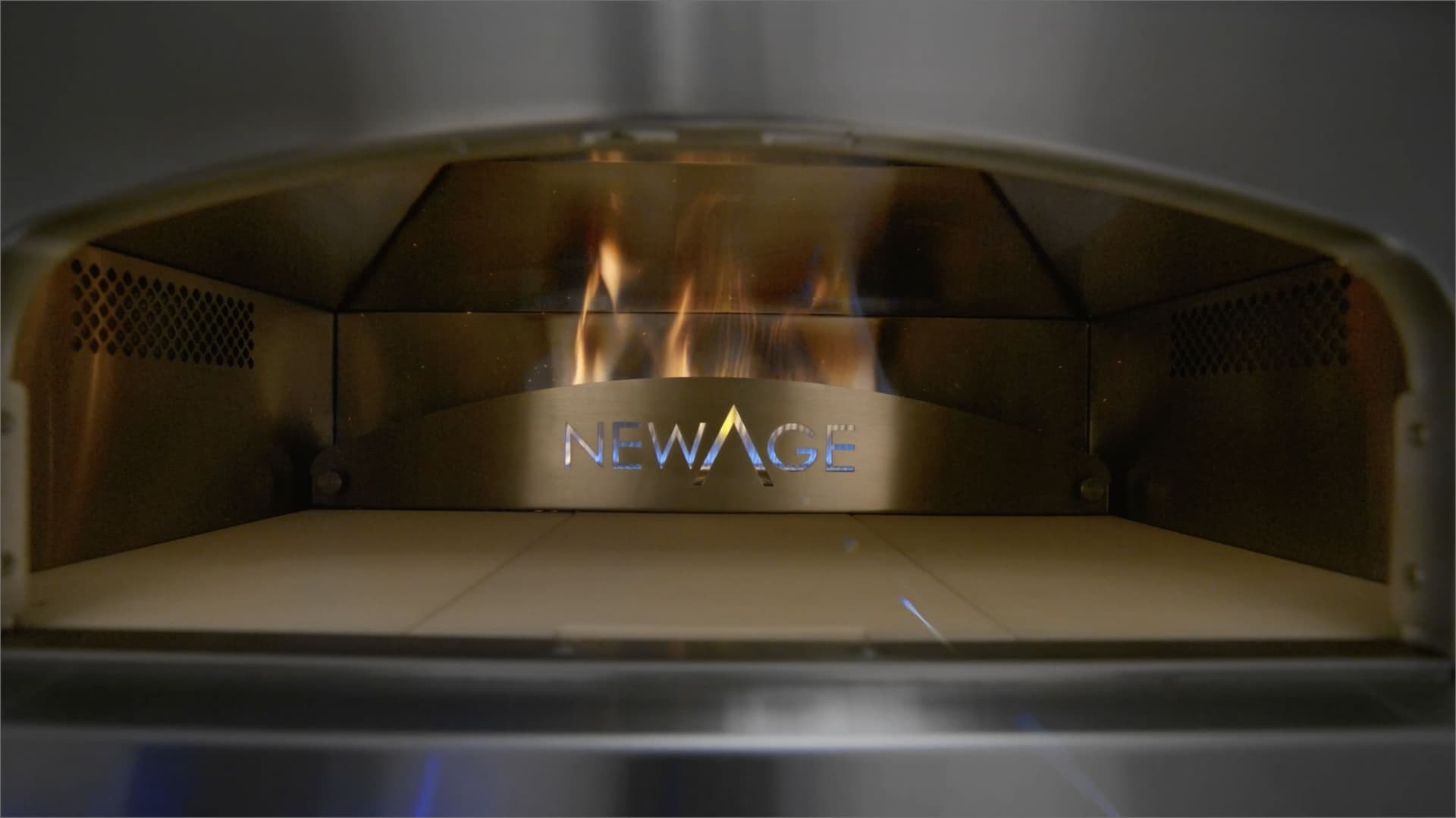 NewAge built-in gas grill and outdoor appliances in a finished outdoor kitchen