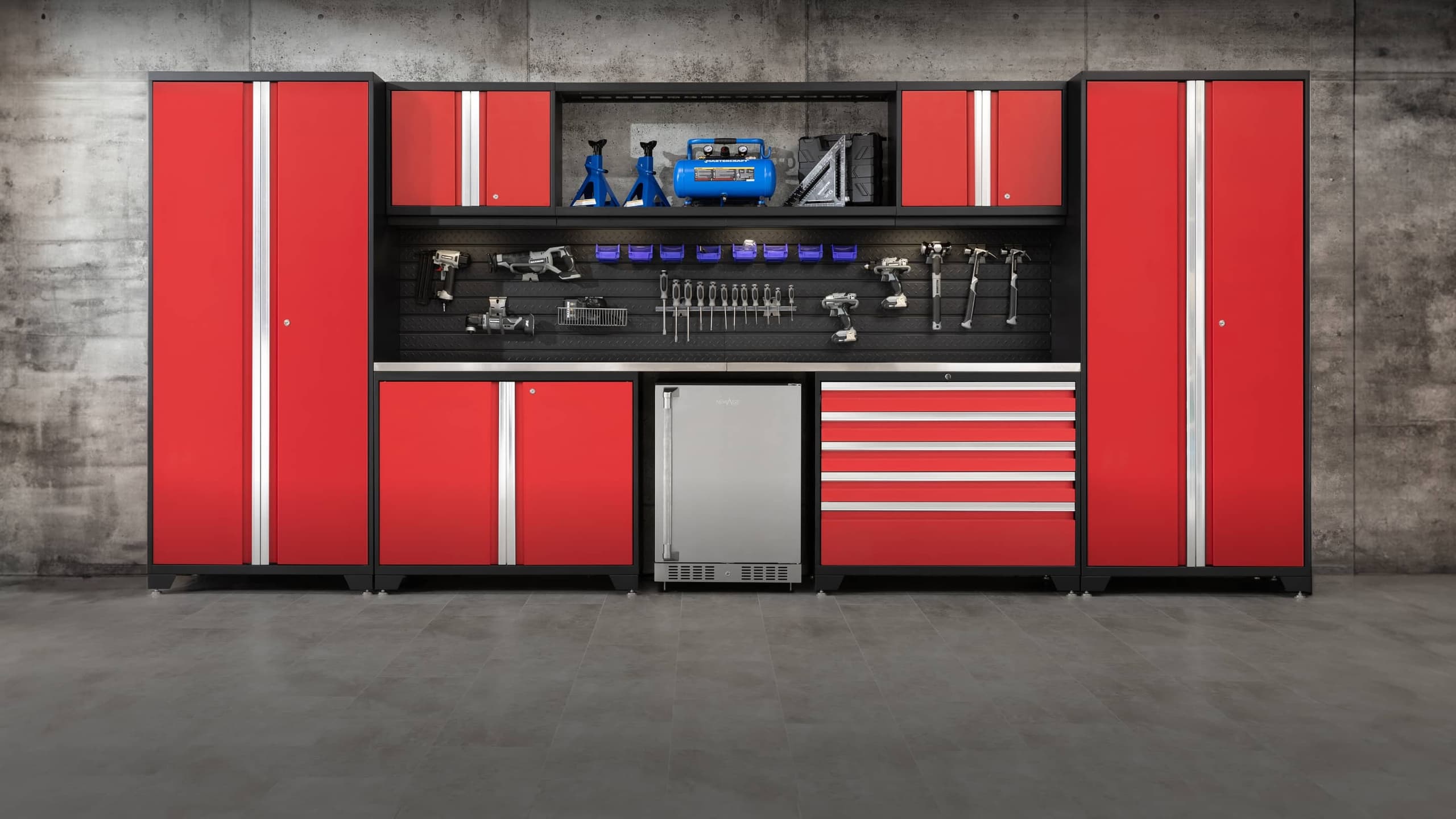 NewAge red garage cabinet set with tall lockers, a pegboard and a drawer tool chest